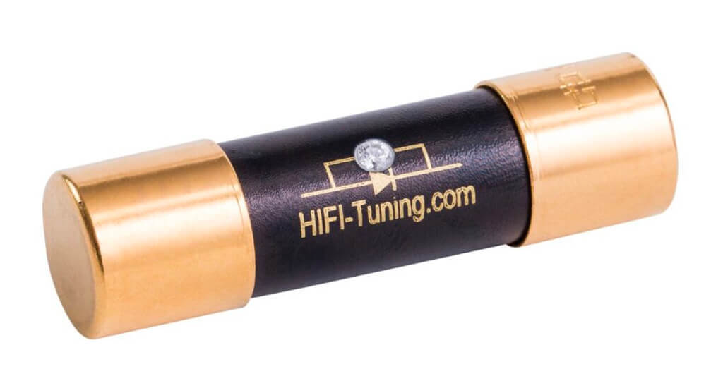 HiFi‑Tuning Supreme³ Diamond fuse with gold-plated end caps, black ceramic body, and central diamond inlay, handmade in Germany for high-end audio systems. 